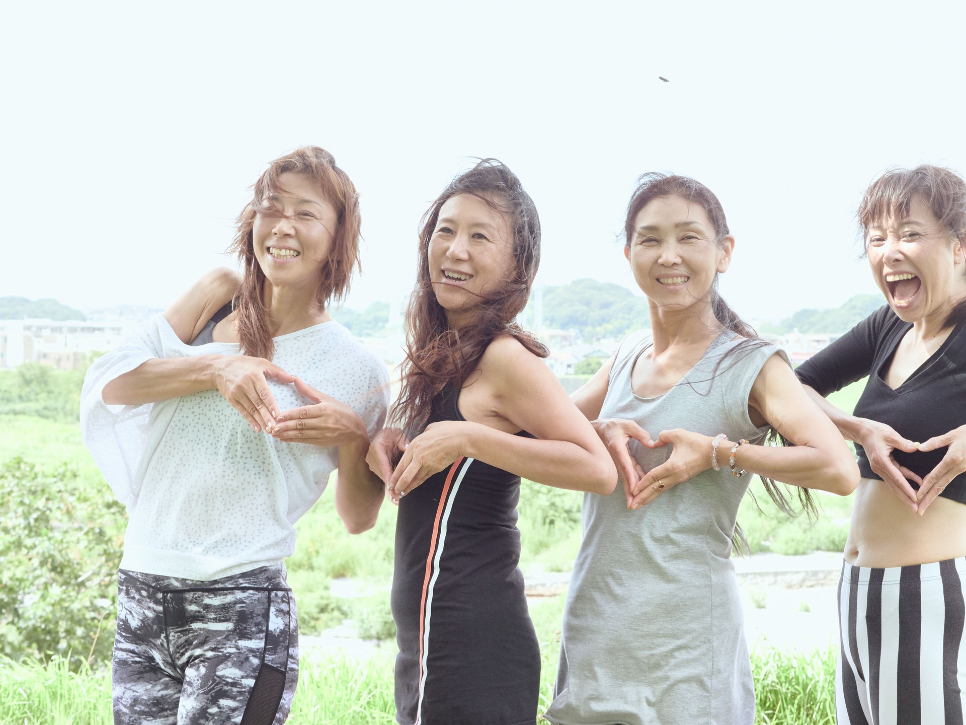 Happy ladies hand-shaped heart