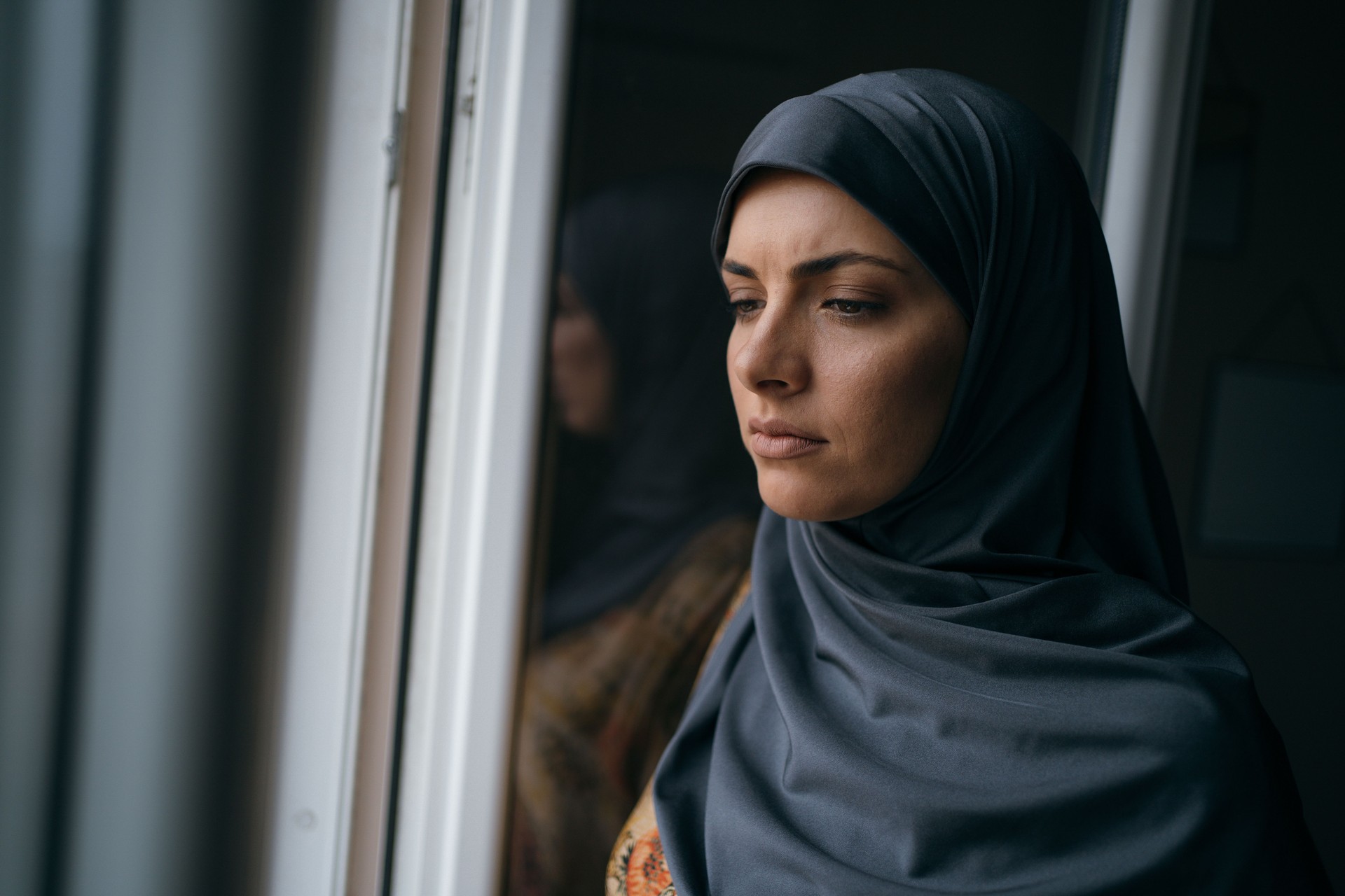 Portrait of worried Muslim woman